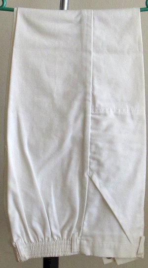 Safari style white jackets with pockets with high waisted pants. South Africa, Pretoria, Villiera