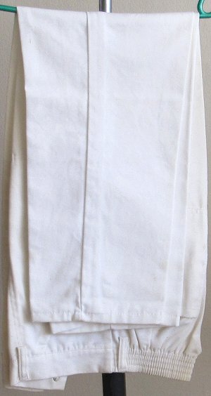 Safari style white jackets with pockets with high waisted pants. South Africa, Pretoria, Villiera
